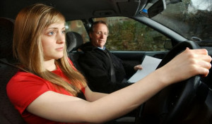 A682T4 Young woman on driving test lesson